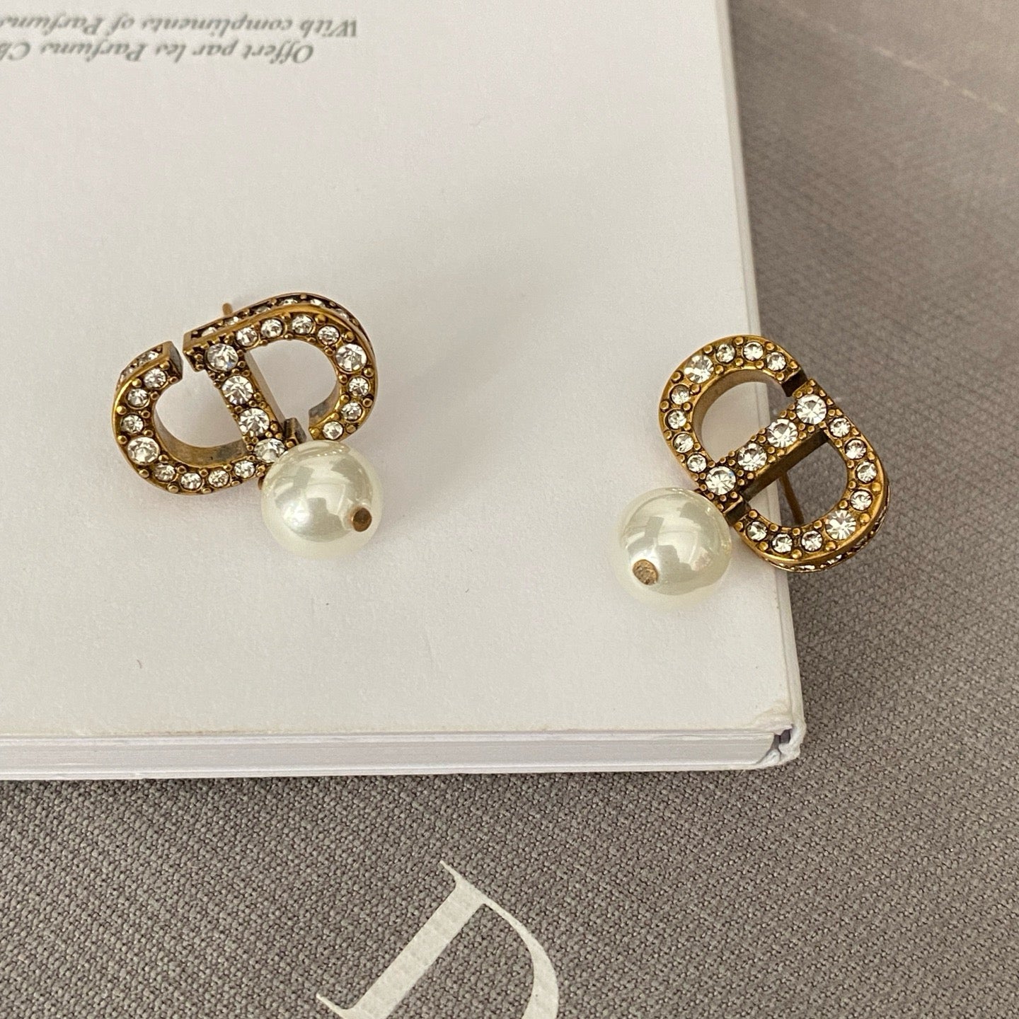 Dicey emblem earrings