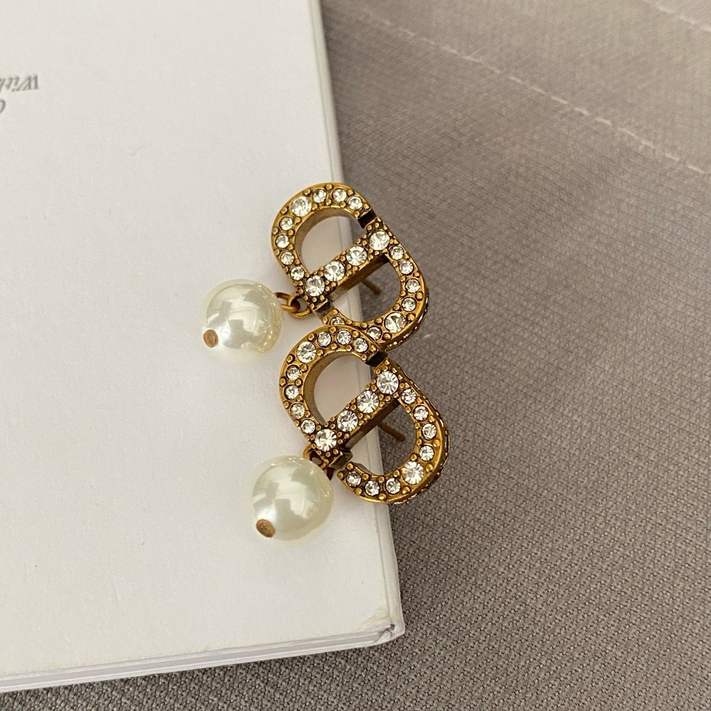 Dicey emblem earrings