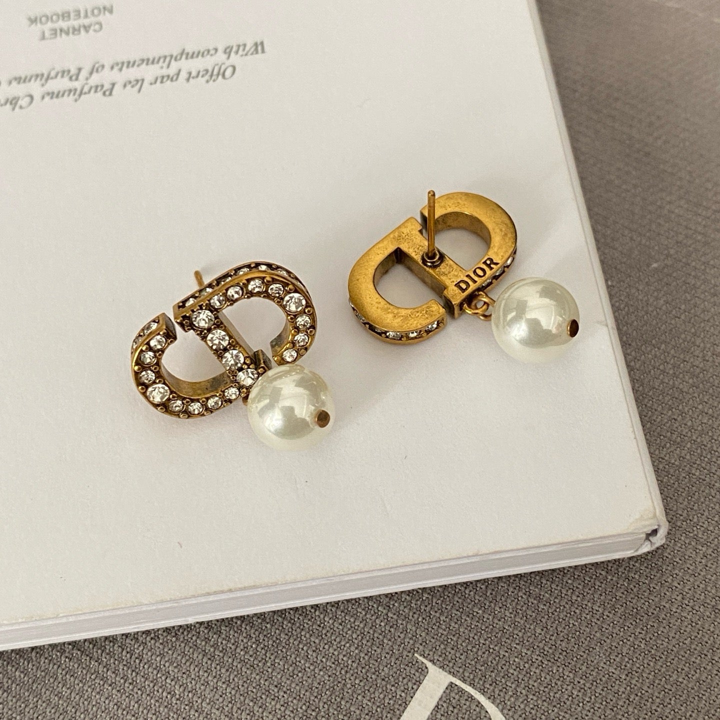 Dicey emblem earrings