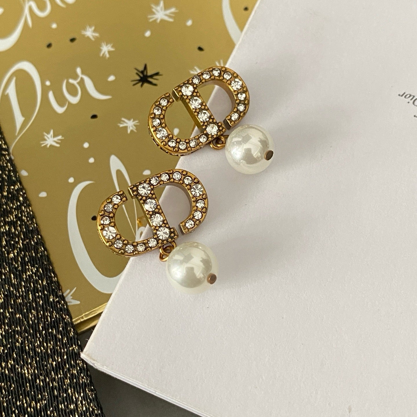 Dicey emblem earrings